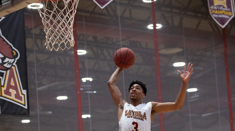 Basketball player shooting hoop