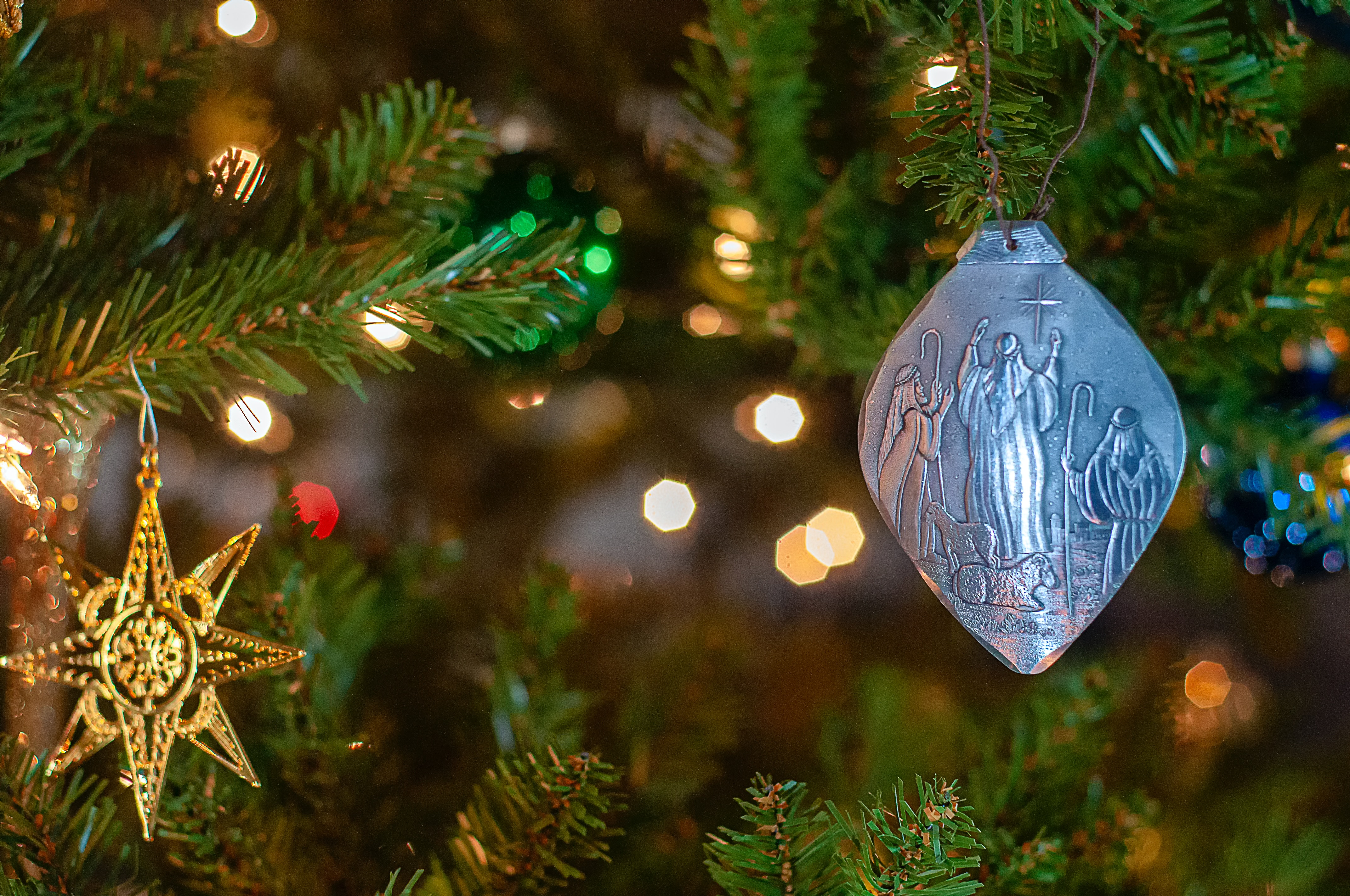 Star of Bethlehem ornament handing on Christmas tree