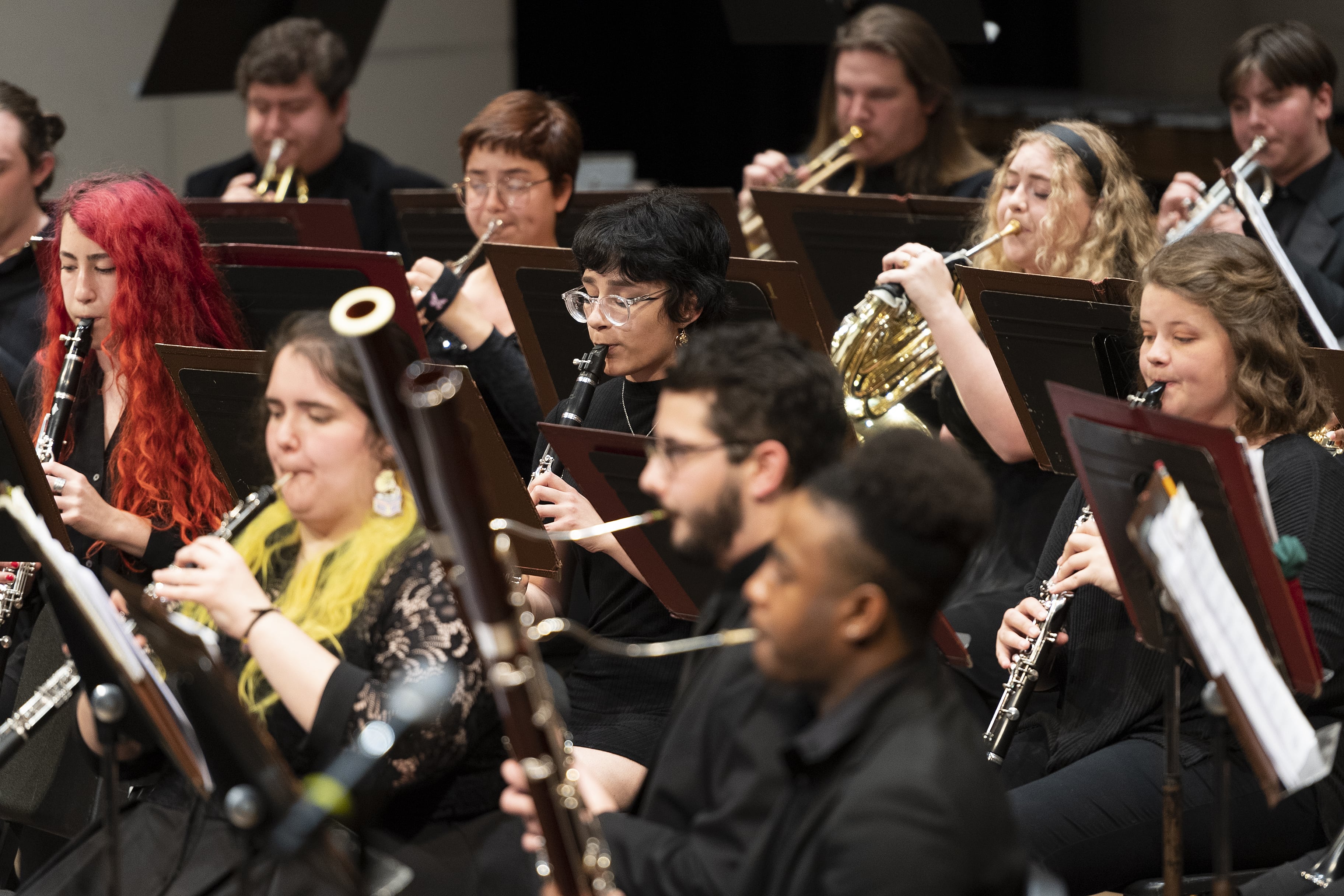 A photo of one of Loyola's bands, with bassoons, oboes, horns, and clarinets in frame.